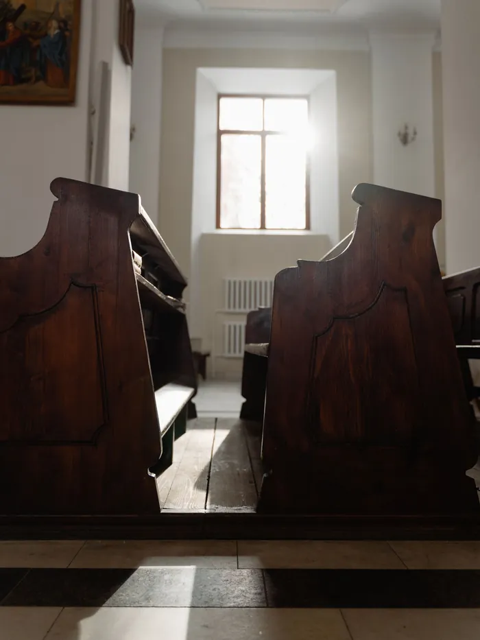 Sunlit church pews